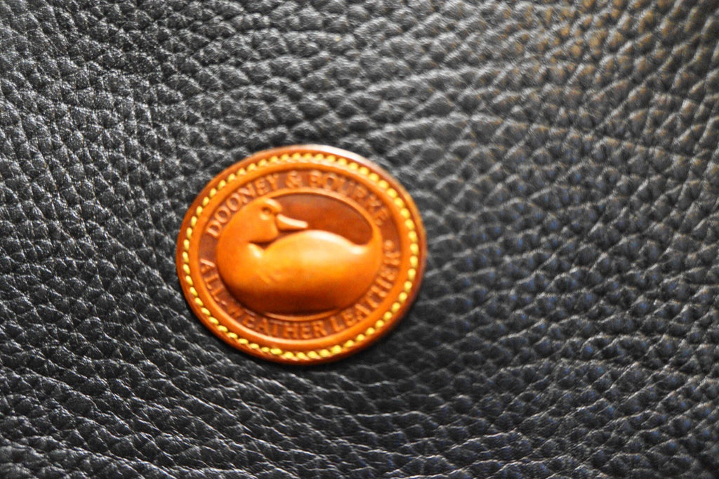 Dooney & Bourke All Weather Leather Black Pebbled British Tan Trim Equestrian