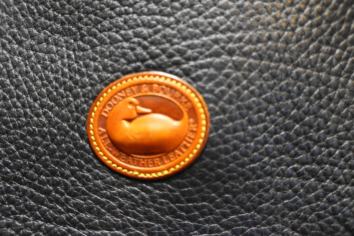 Dooney & Bourke All Weather Leather Black Pebbled British Tan Trim Equestrian
