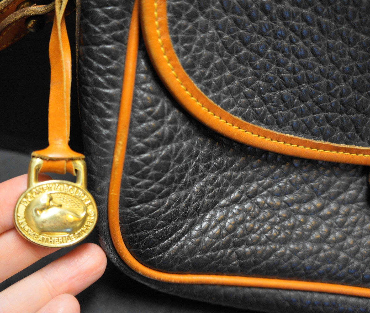 Dooney & Bourke All Weather Leather Black Pebbled British Tan Trim Equestrian